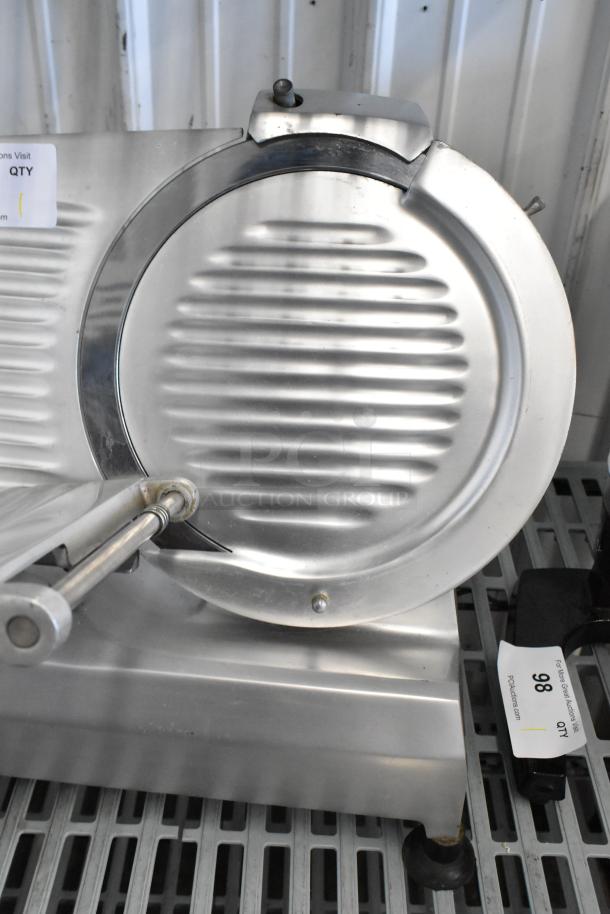 Omcan 300E stainless steel commercial countertop meat slicer with blade sharpener, 115V, 1 phase, excellent condition.