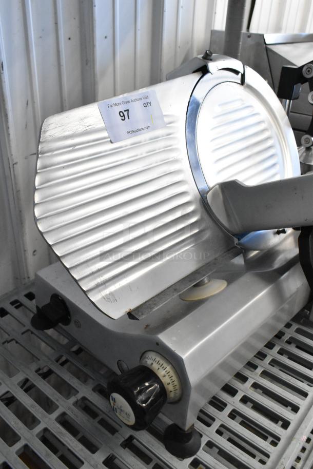 Omcan 300E stainless steel meat slicer with blade sharpener, countertop model, 115V, 1 phase, good condition.