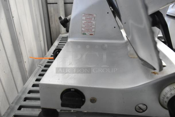 Omcan 300E stainless steel commercial meat slicer with blade sharpener, 115V, 1 phase. Features control knob, visible warning label.