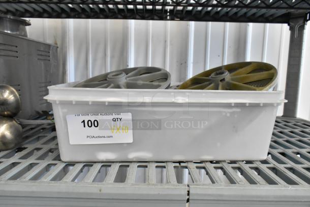 Container with 10 various food processor blades on a shelf. Label indicates quantity VX10, item number 100.