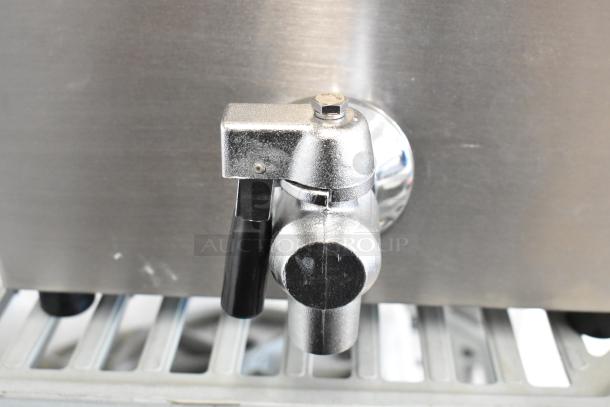 Vollrath FFA8115 stainless steel fryer spout detail, showing chrome finish and black handle.