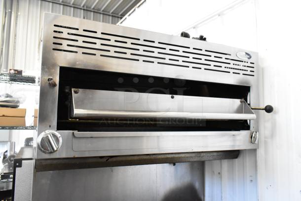 American Range stainless steel salamander cheese melter, part of 6-burner range with oven. Gas-powered, commercial-grade.