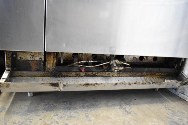 American Range stainless steel commercial gas 6-burner range with oven shown, fair condition, some visible rust and wear.