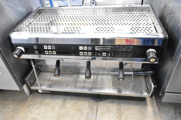 Dalla Corte Evolution 20.03 stainless steel espresso machine, 3 group heads, 3 portafilters, 2 steam wands, 220V, commercial use.