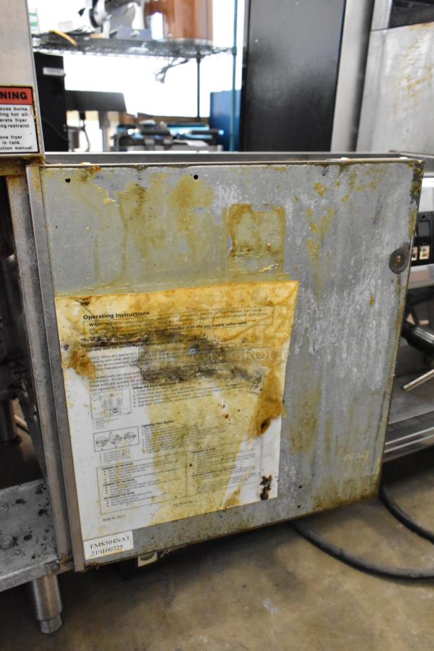 2021 Cecilware FMS504NAT stainless steel deep fat fryer, natural gas powered, with visible operating instructions and wear.