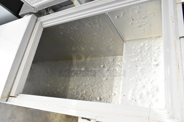 2024 Coldline CF76 commercial chest freezer with 2 hinge lids, 115 volts. Interior shows wear; suitable for high-capacity storage.