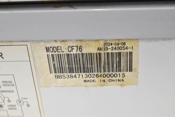 Label on Coldline CF76 commercial chest freezer, shows model, barcode, "Made in China," and production date 2024-04-08.