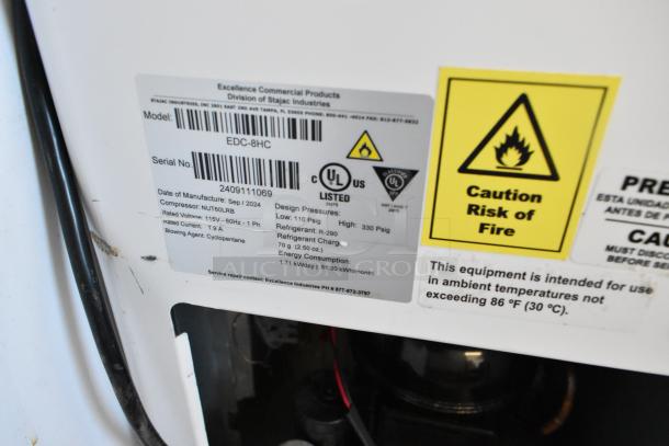 "2024 Excellence EDC-8HC metal commercial chest freezer label showing model, voltage, and safety warnings."