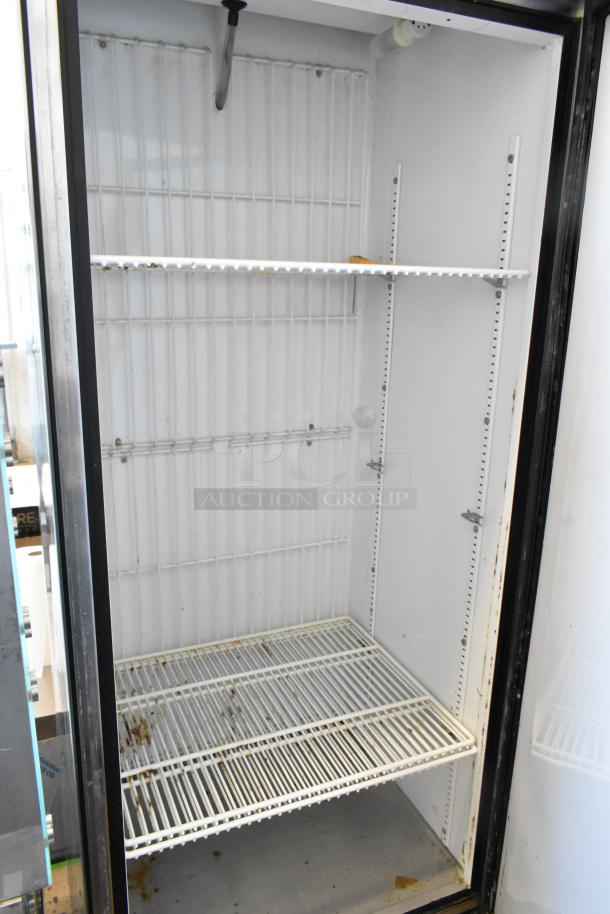 True T-19F stainless steel single door reach-in freezer, 115 volts, 1 phase. Shelf wear visible, interior in fair condition.