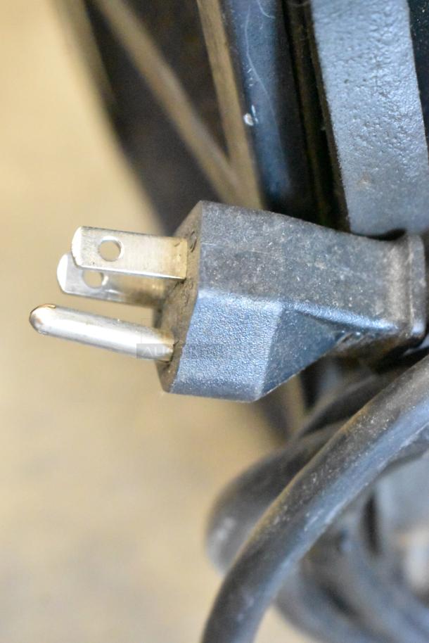 Close-up of a power plug for an Ice Qube IQ1800VS air conditioner, 120 volts, 1 phase.