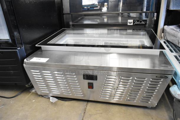 Brand new KoolMore KM-CGD-8HP ice cream display case with 4 pans, stainless steel, glass sneeze guard, and visible broken glass.