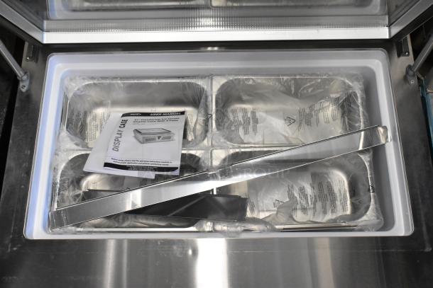 KoolMore KM-CGD-8HP stainless steel ice cream display case, new with 4 pans, includes manual. Note broken glass, 110-120V.