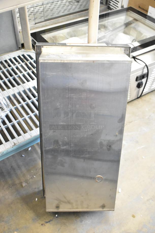 Bobrick stainless steel hand dryer in used condition, visible surface scratches and marks, suitable for commercial use.