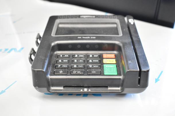 Ingenico iSC Touch 250 credit card reader with keypad, touchscreen, and card slot, shown slightly used.