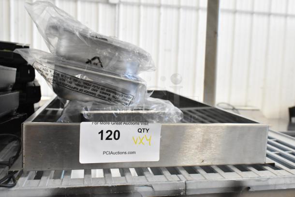 Four stainless steel drop-in bins in packaging, labeled QTY Vx4, item 120 at PCI Auctions.