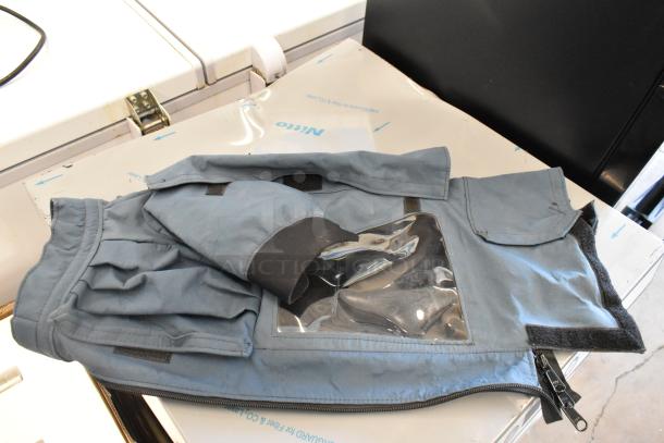 Two camera bags, including Porta Brace and Forecast, with zip closures and clear panel, in used condition.