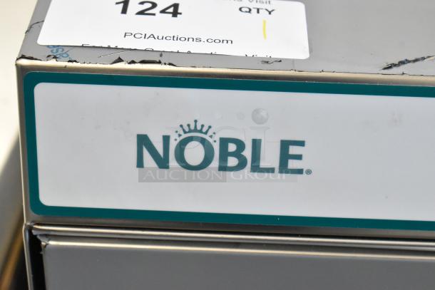 Brand new Noble 495HTUC24 stainless steel undercounter dishwasher with visible scratches and dents, model label shown.