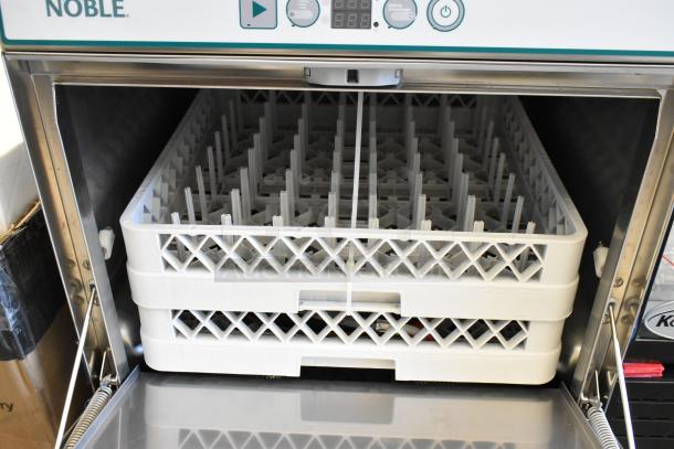 Brand new Noble 495HTUC24 stainless steel commercial undercounter dishwasher with booster heater, minor scratches.