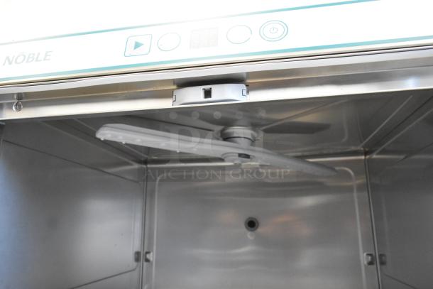 Noble 495HTUC24 stainless steel undercounter dishwasher interior; features high-temperature cleaning, visible spray arm.