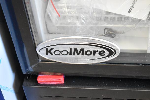 Brand new KoolMore KM-MDR-1GD-10C single door cooler, scratch and dent condition, with poly coated racks, on casters.