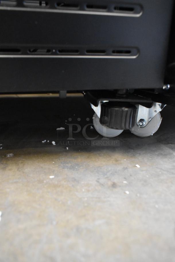 BRAND NEW KoolMore KM-MDR-1GD-10C cooler with poly-coated racks, commercial casters shown. Scratch and dent condition.