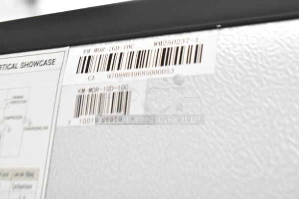Barcode and label on KoolMore KM-MDR-1GD-10C reach-in cooler, indicating model and specifications.