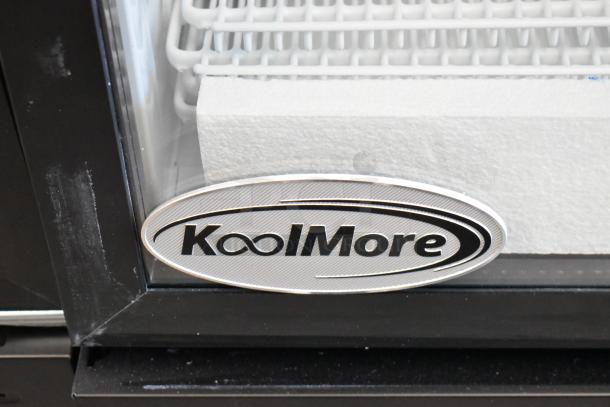 KoolMore single door reach-in cooler with poly coated racks, shown with logo on glass door. Model KM-MDR-1GD-10C.