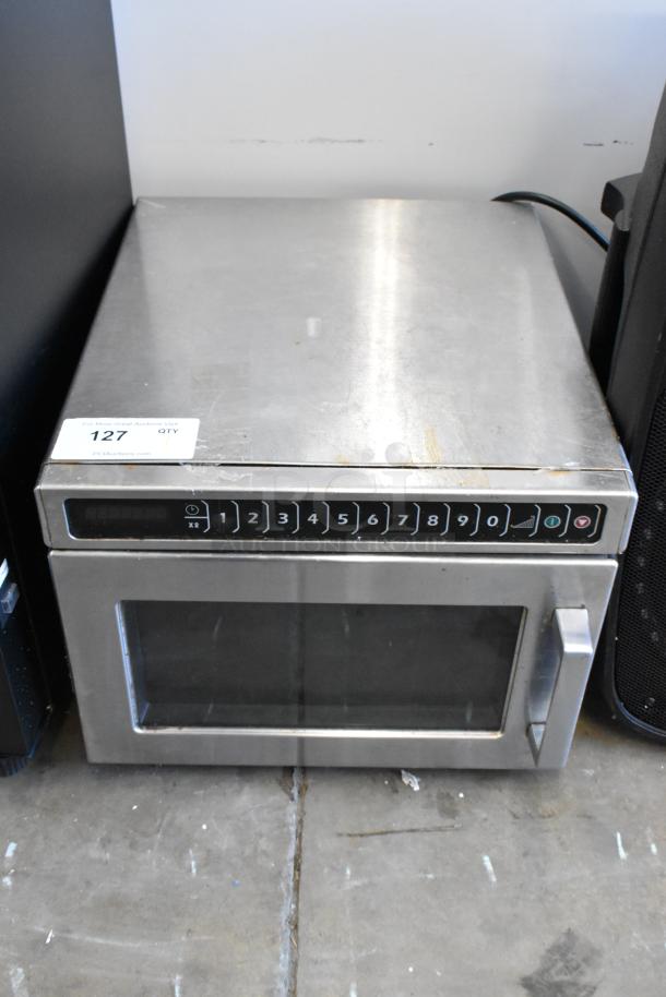 Amana HDC12A2 stainless steel commercial countertop microwave oven, 120 volts, 1 phase, keypad controls shown.