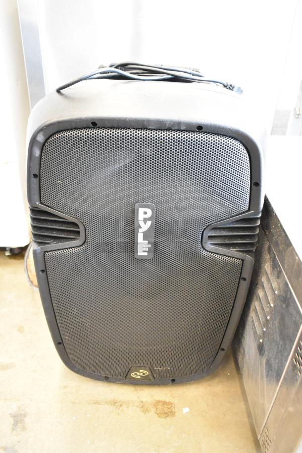 Pyle PPHP1569UT speaker in black, used condition, with visible logo, mesh grille, and attached cables.