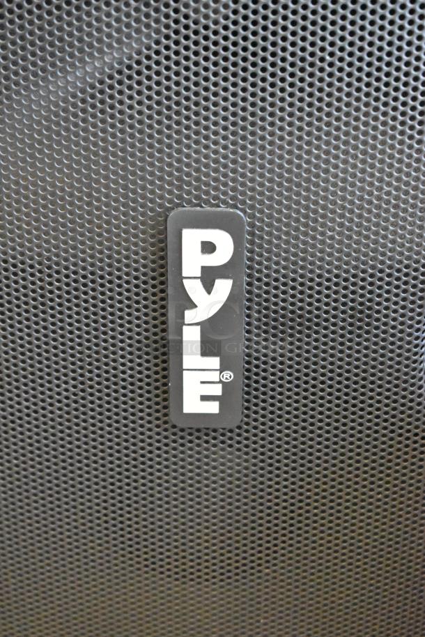 2 Pyle speakers, models PPHP1569UT and PPHP1599WU. Black mesh grille with Pyle logo. 2 times your bid offer.