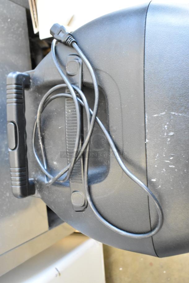 Pyle PPHP1569UT speaker, black, handle visible, with attached power cable; slightly worn surface.