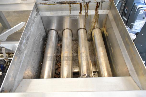 Keating stainless steel gas deep fat fryer, used condition, internal heating tubes, full level mark visible, on casters.