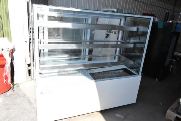 Brand new Avantco 193BCF60W 35 3/8" white refrigerated bakery display case, scratch and dent, with square glass and commercial casters.