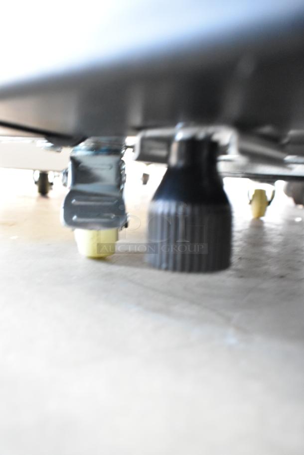 Close-up of KoolMore KM-MDR-1D-6C single door reach-in cooler caster. Poly-coated, metal, 115 volts, 1 phase.