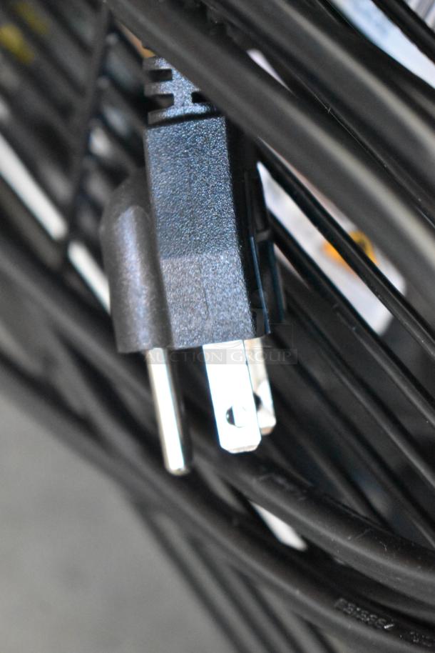 Close-up of the power cord for a KoolMore KM-MDR-1D-6C cooler, indicating its new condition and functionality.