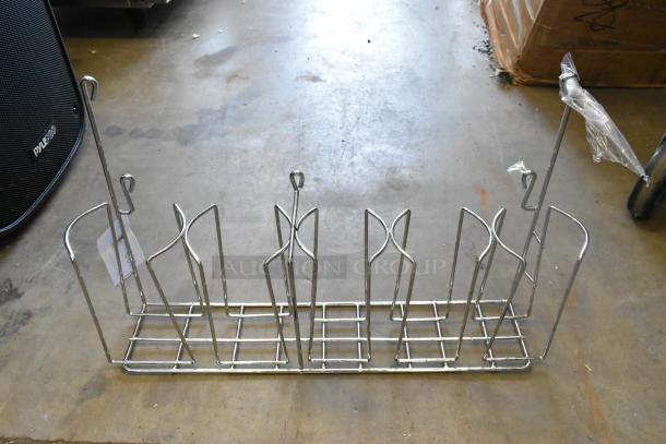 Brand new metal rack with wireframe design, minor scratches. Ideal for storage. Includes protective plastic wrap and tags.