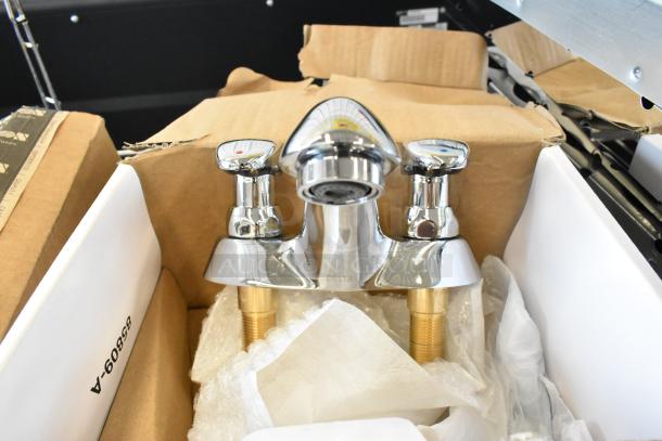 Brand new Delta faucet, chrome finish, visible minor scratches and dents, includes installation components.