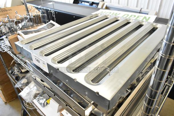 Set of five new metal grease hood filters with minor scratches and dents. Includes labels indicating auction details.