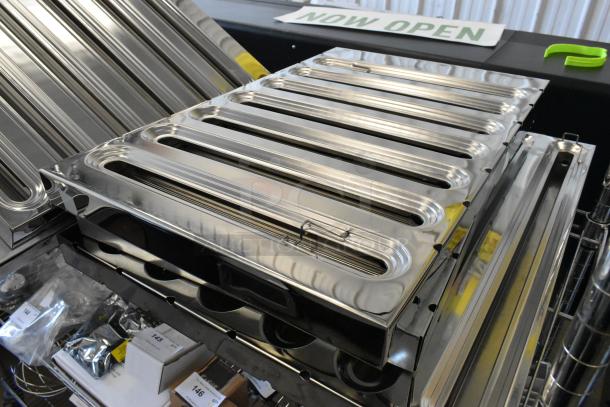 Five brand new scratch and dent metal grease hood filters, shiny finish, various sizes, in excellent condition.