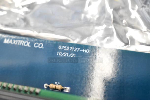 Maxitrol Co. circuit board, model 07527127-H01, dated 10/21/21, with visible resistor labeled R2.