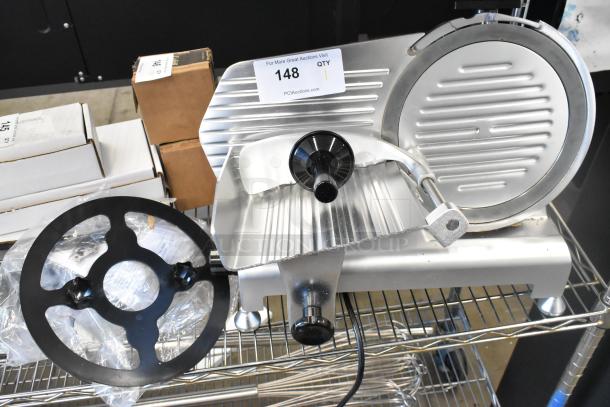 Brand new Avantco 177SL310 metal meat slicer with blade sharpener, countertop model, 115V, minor scratches visible.