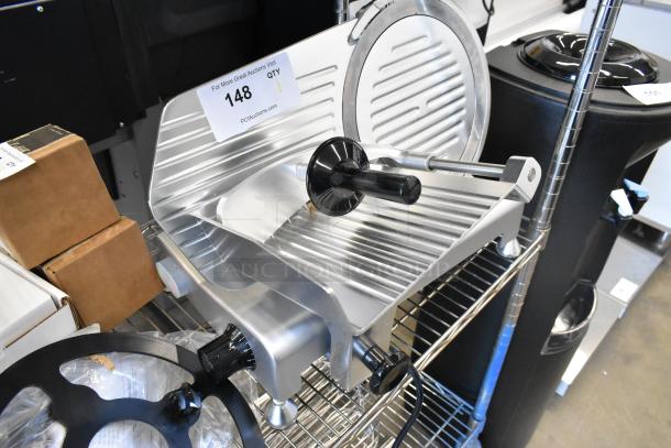 Avantco 177SL310 metal commercial countertop meat slicer, brand new with blade sharpener, 115 volts, visible auction tag.