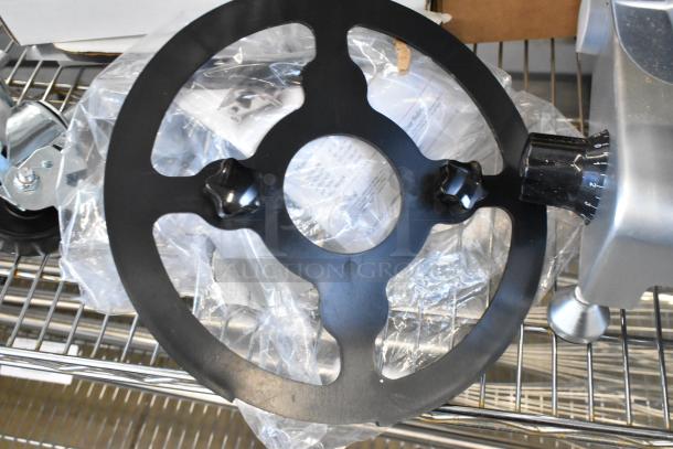 Brand new Avantco 177SL310 commercial meat slicer with blade sharpener, scratch and dent condition, metal construction.