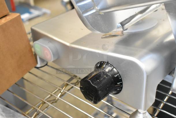 Brand new Avantco 177SL310 metal meat slicer, countertop model with built-in blade sharpener, 115 volts, 1 phase.