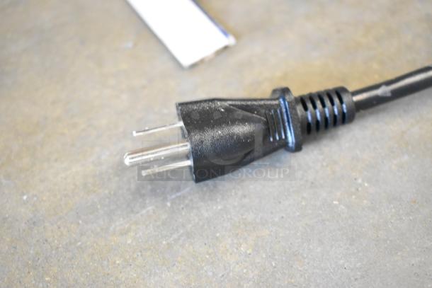 Close-up of a power plug for Avantco 177SL310 metal commercial countertop meat slicer, 115 volts, scratch and dent condition.