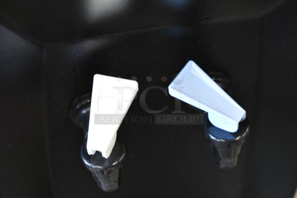 BRAND NEW scratch and dent Oasis QBPD1SK water cooler base, 115V, 1 phase, featuring dual spouts in white and blue.