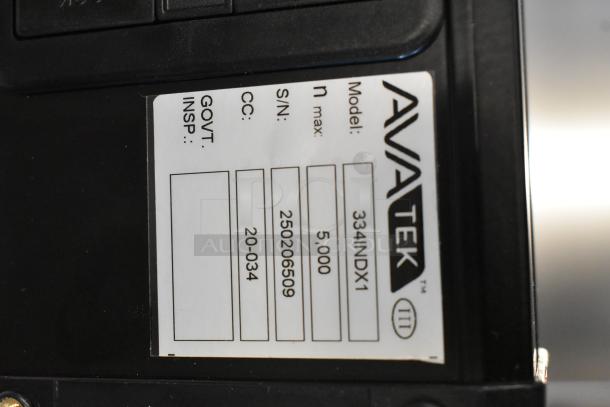 Brand new AvaTek 334BS300TX digital bench scale with tower display, 300 lb capacity, scratch and dent condition, model label.