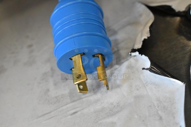 Broken plug of a new Advance Tabco SW-4E-240-BS hot food table, showing damage to one prong.