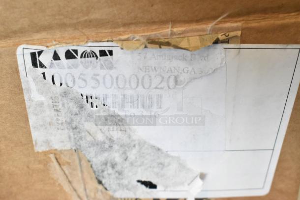 Close-up of a partially torn label on a package showing "Kason" and the number "10055000020," indicating a new item with possible scratches or dents.