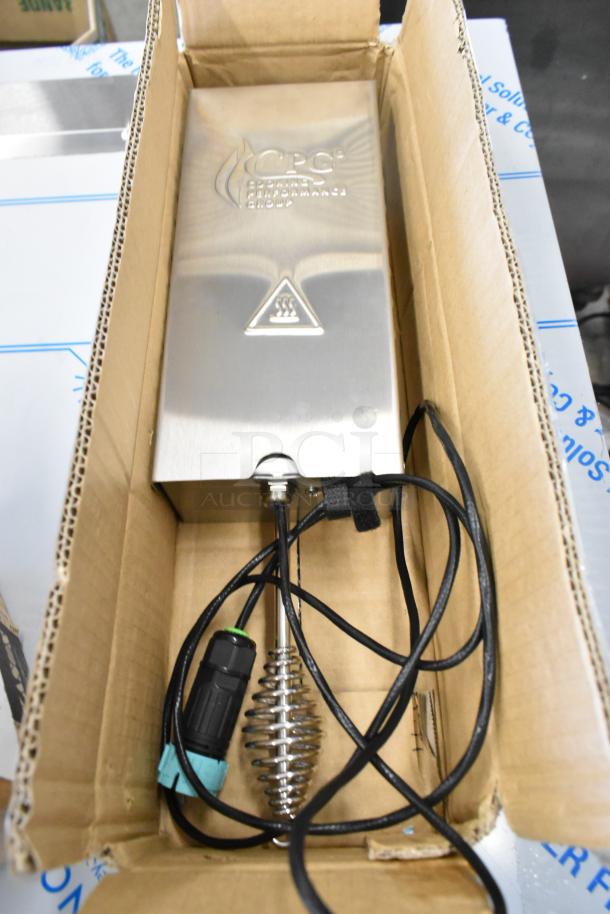 New Cooking Performance Group 351SMKR208 Smoker Box in cardboard packaging, stainless steel finish, with cables visible.